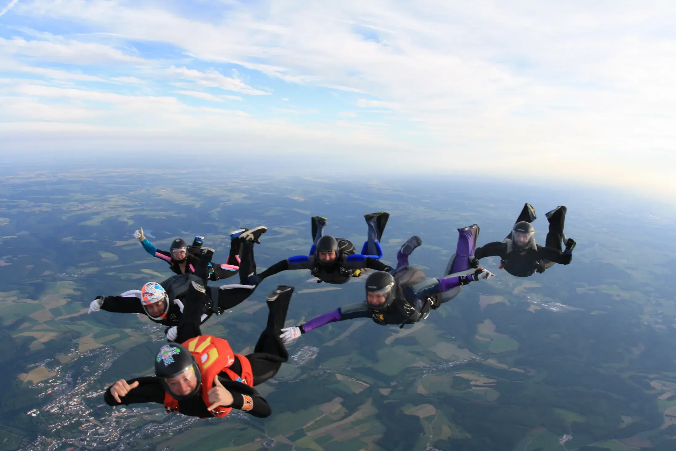 Skydivers in freefall above Luxembourg